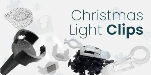 Christmas light clips in various designs and colors, including black plastic with a decorative pattern.
